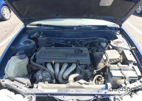 2002 Toyota Corolla Le из США, поврежденный, VIN 2T1BR12E52C558044